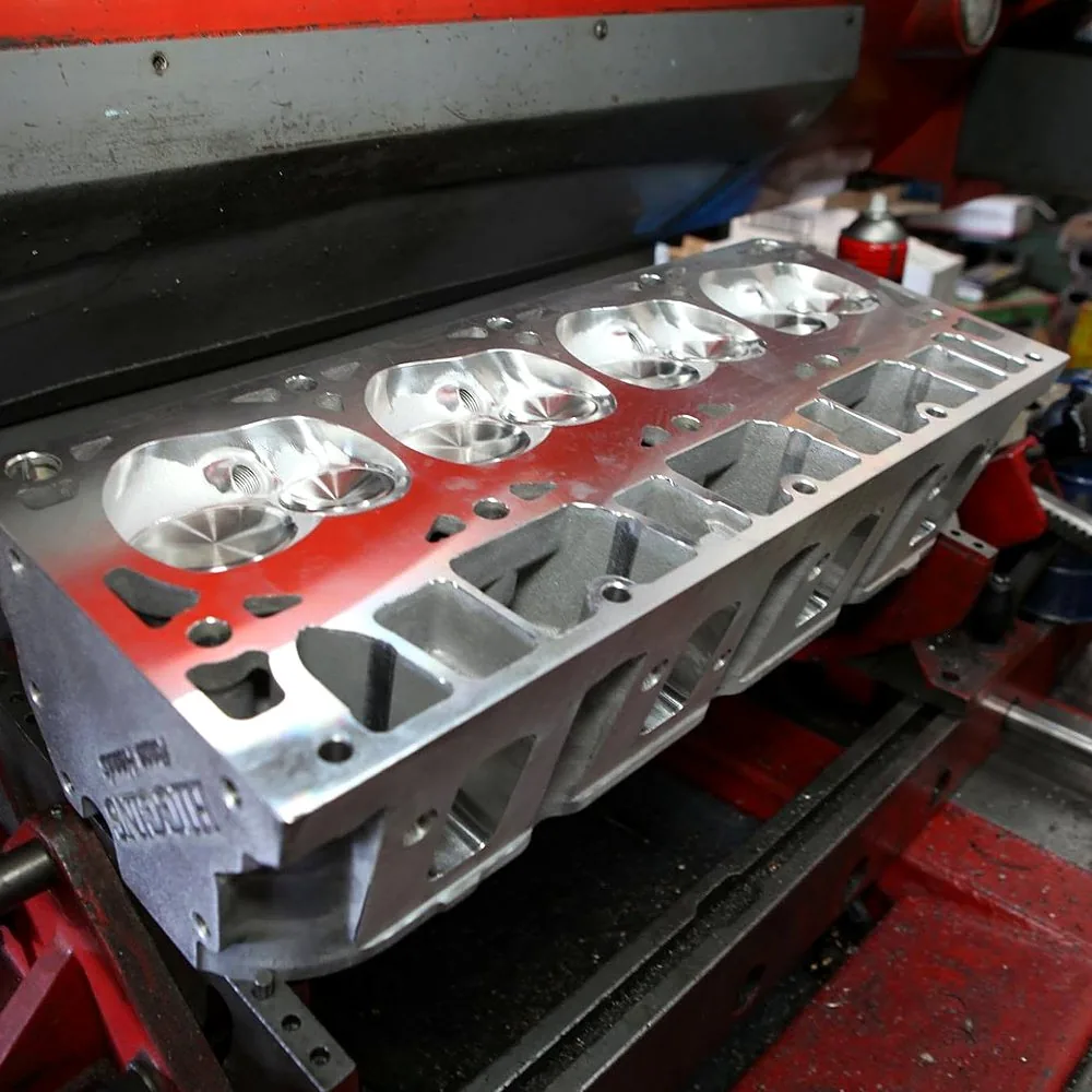 Cylinder head intake ports and valve seats — the airflow path into the combustion chamber that carbon deposits restrict