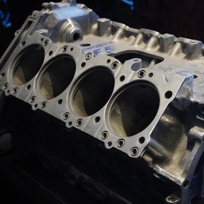 Intake valves in new condition — clean machined ports, bare metal, no deposits