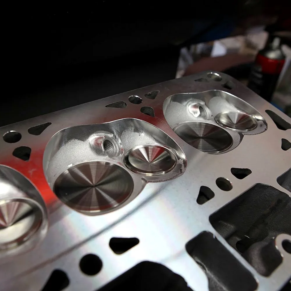 Freshly machined cylinder head intake ports in new condition — full designed cross-section, no deposits